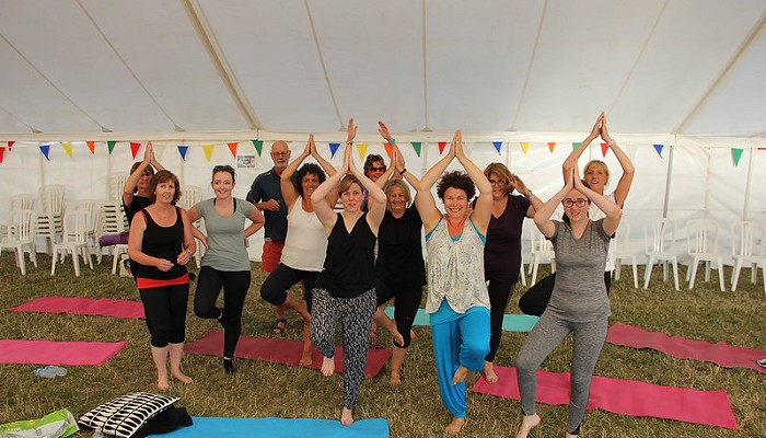 group doing yoga moves