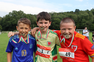 3 boys with medals