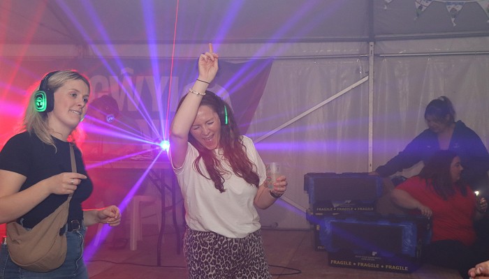 woman enjoying and dancing during the silent disco